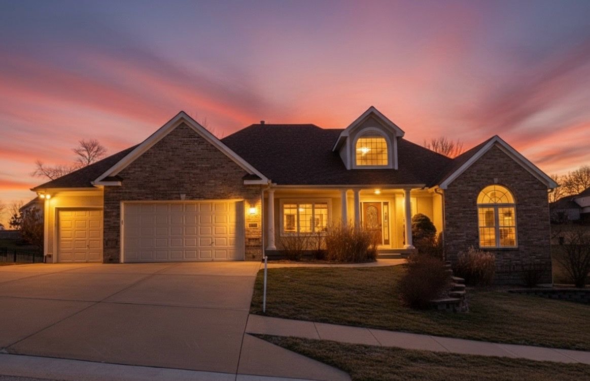 Traditional brick home exterior mature trees